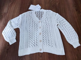 Buttoned cream knitted cardigan