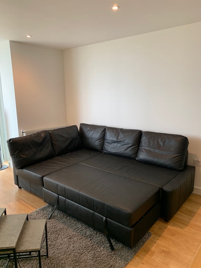 Corner sofa-bed with storage